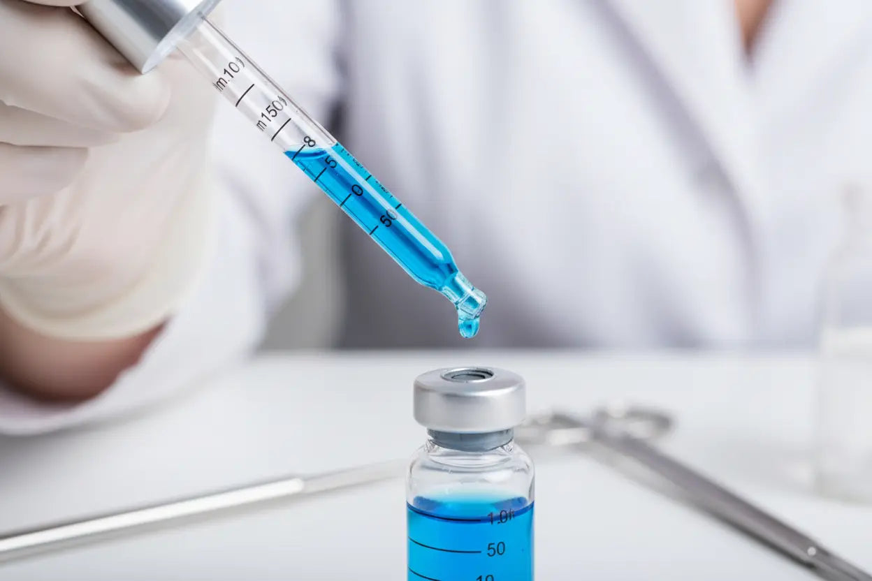 Precision dropper with methylene blue liquid and clock representing optimal daily timing for supplementation